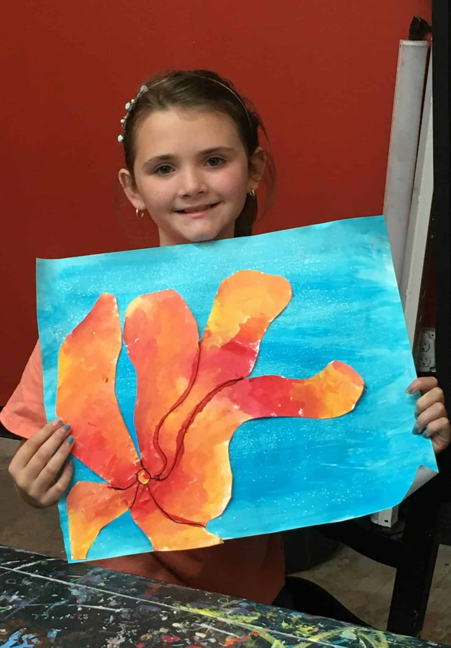 girl holding flower painting
